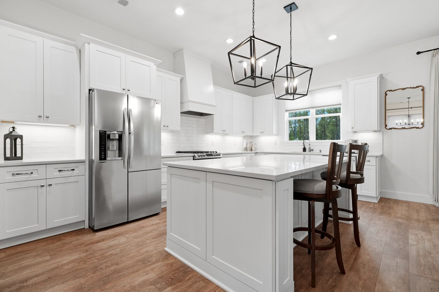 Chef's kitchen with island and lantern pendants