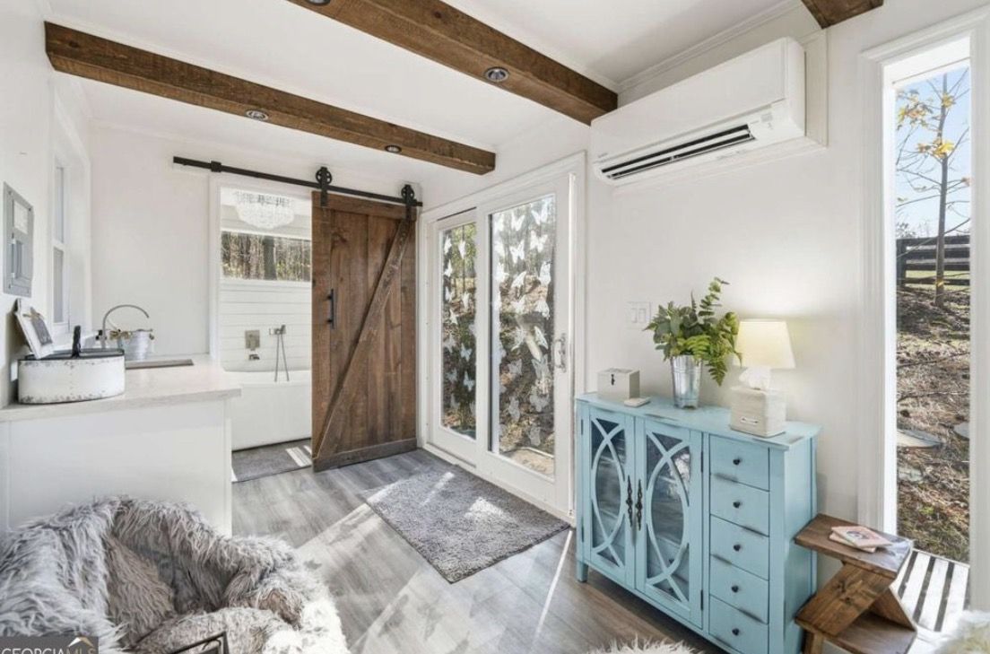 Barn-door entry with forest views